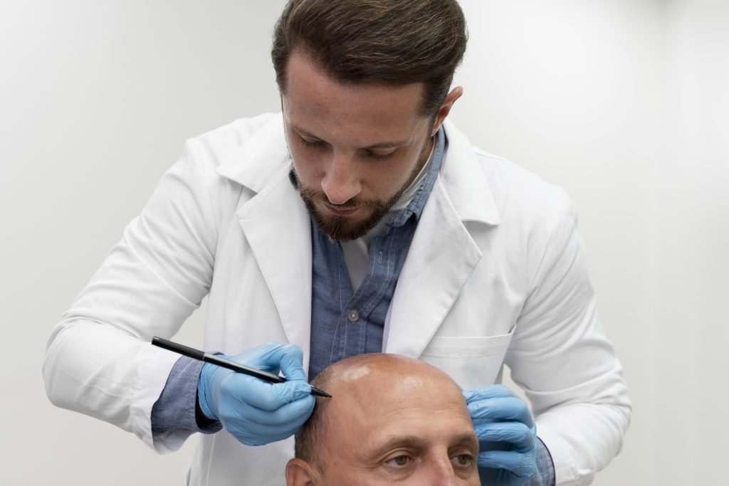 mature man going through follicular unit extraction process 3